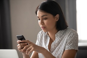 Woman looking at her cell phone